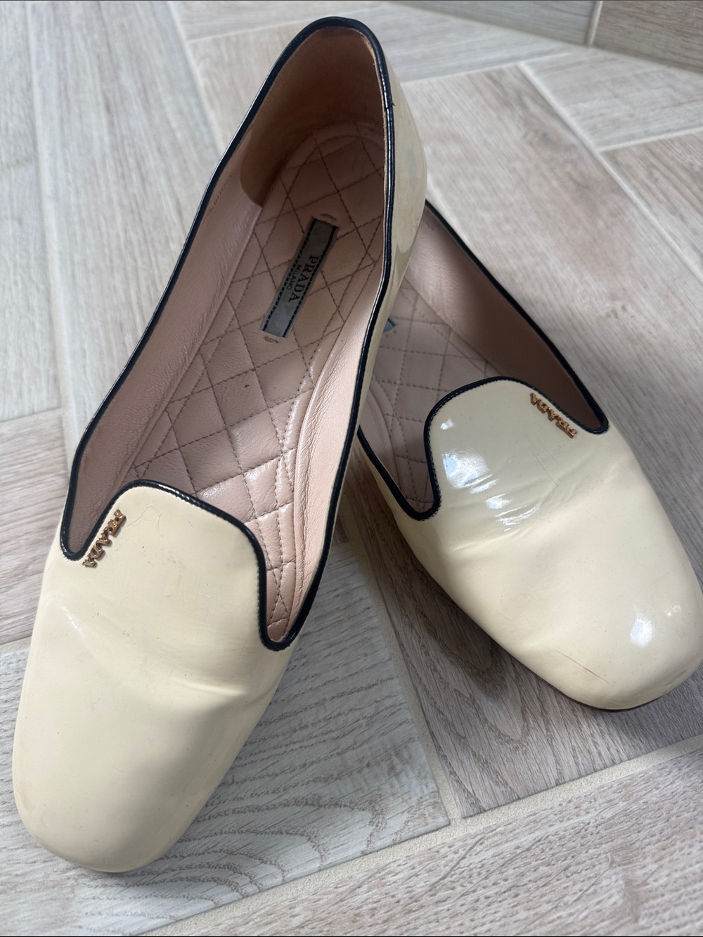 Prada Cream Patent Leather Slip-On Loafers with Black Trim